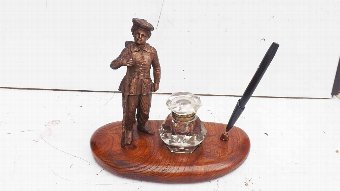 antique inkwell with military theme