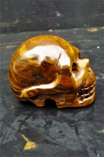 Antique Skull of Doom carved in the eye of the Tiger stone. 