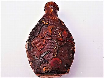 Chinese carved amber snuff bottle and top 