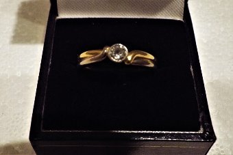 Solitaire diamond on two tone gold ring