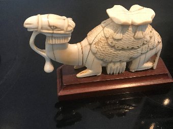 camel on wooden base