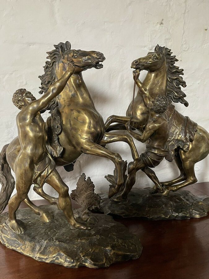 Antique A FINE PAIR OF GILT-BRONZE MODELS OF THE MARLEY HORSES.