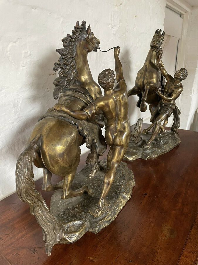 Antique A FINE PAIR OF GILT-BRONZE MODELS OF THE MARLEY HORSES.