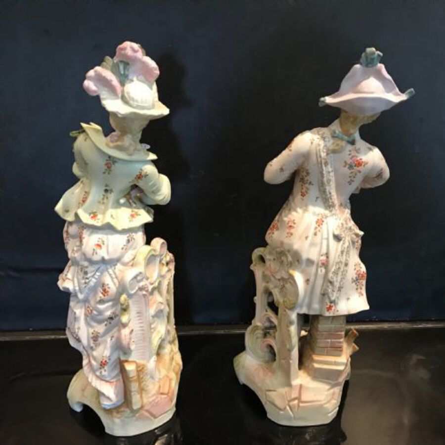 Antique Pair of  porcelain figures of Georgian dressed gentry.