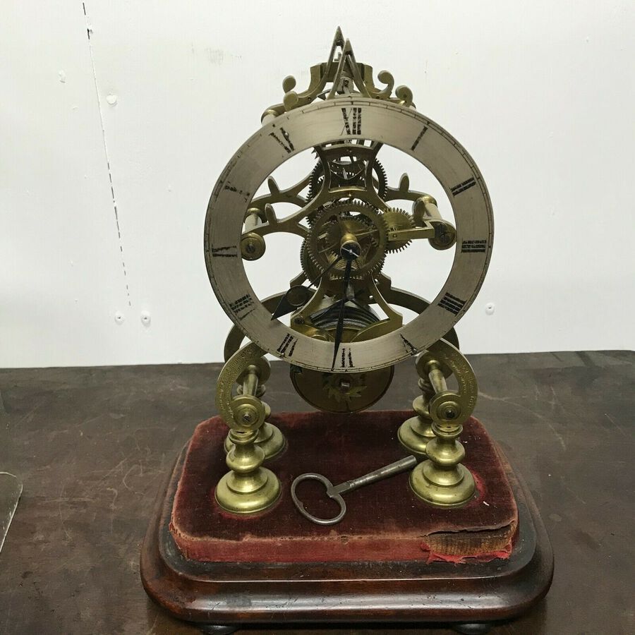 Antique Skeleton clock with glass dome