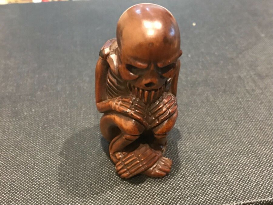 Japanese carved seated Skeleton figure wooden netsuke