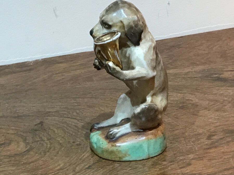 Antique Dog blowing his horn potter figure German 