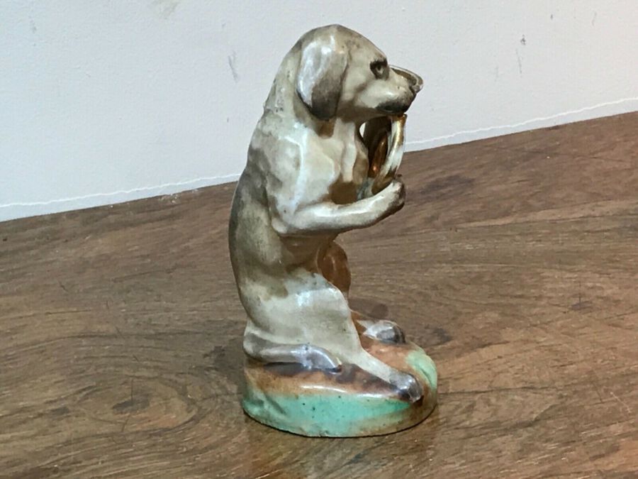 Antique Dog blowing his horn potter figure German 
