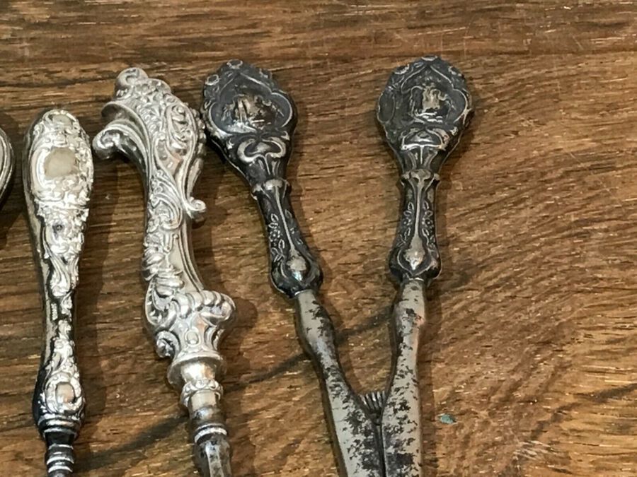 Antique Solid silver handles to four items of victoriana