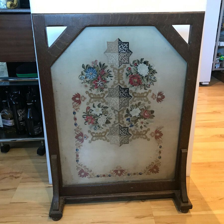 Needle work antique in oak behind glass free standing