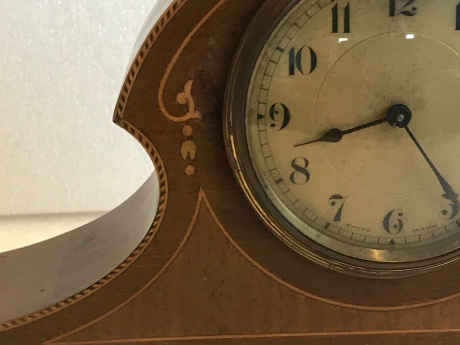 Antique Antique Art nouveau mahogany mantle clock with inlaid decoration.