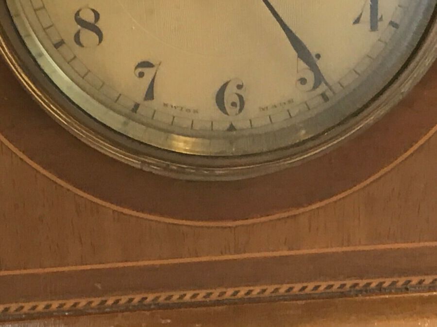 Antique Antique Art nouveau mahogany mantle clock with inlaid decoration.