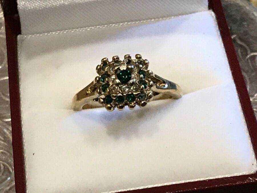 Emerald and stones cluster lady’s ring