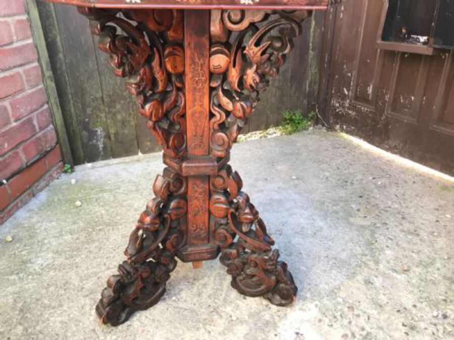 Antique Chinese table inlaid with bone and exotic woods.