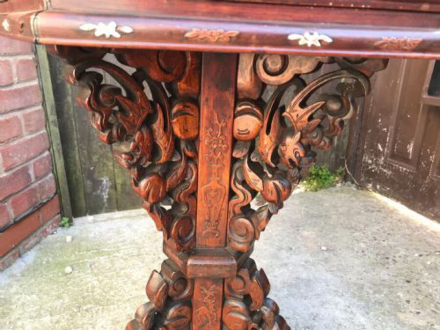 Antique Chinese table inlaid with bone and exotic woods.