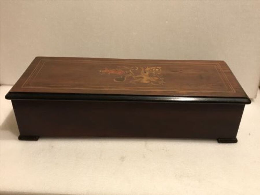 Antique Music box playing ten airs with inlaid case