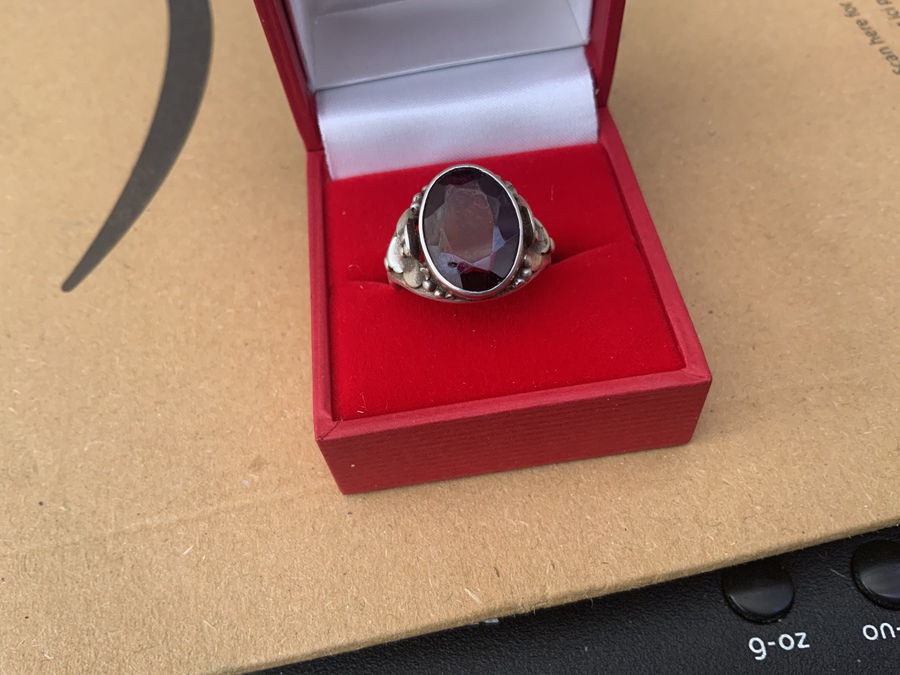 Mans silver ring and black stone