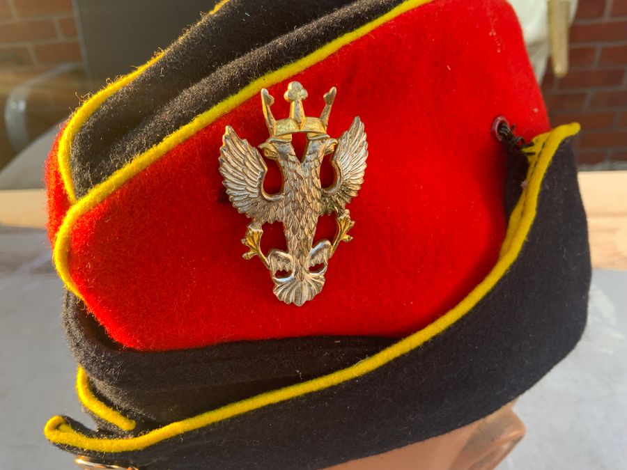 Antique British Hussars peaked cap and Badge