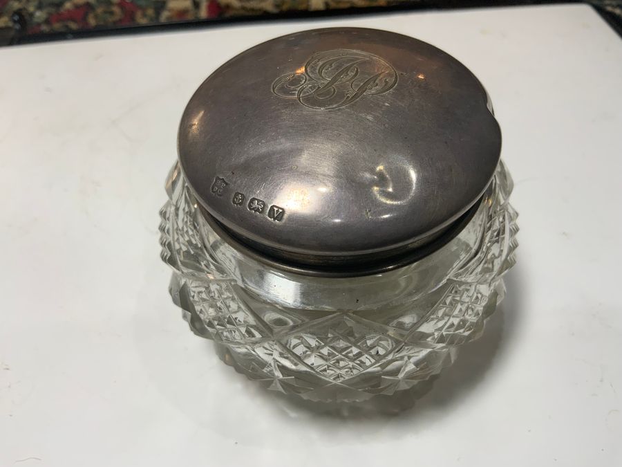 Silver topped cut glass container