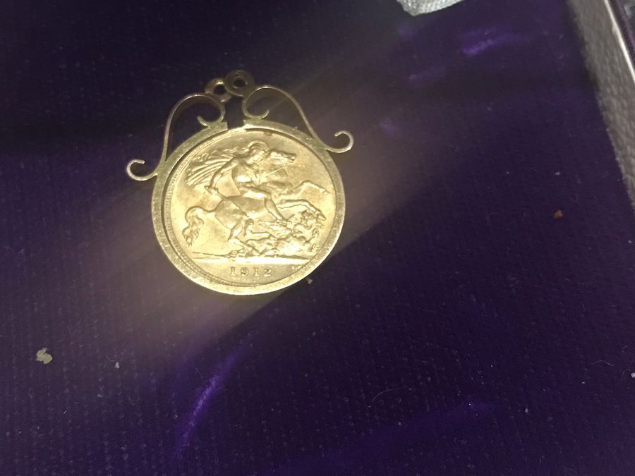 Antique Half Sovereign in  gold 9Ct mount