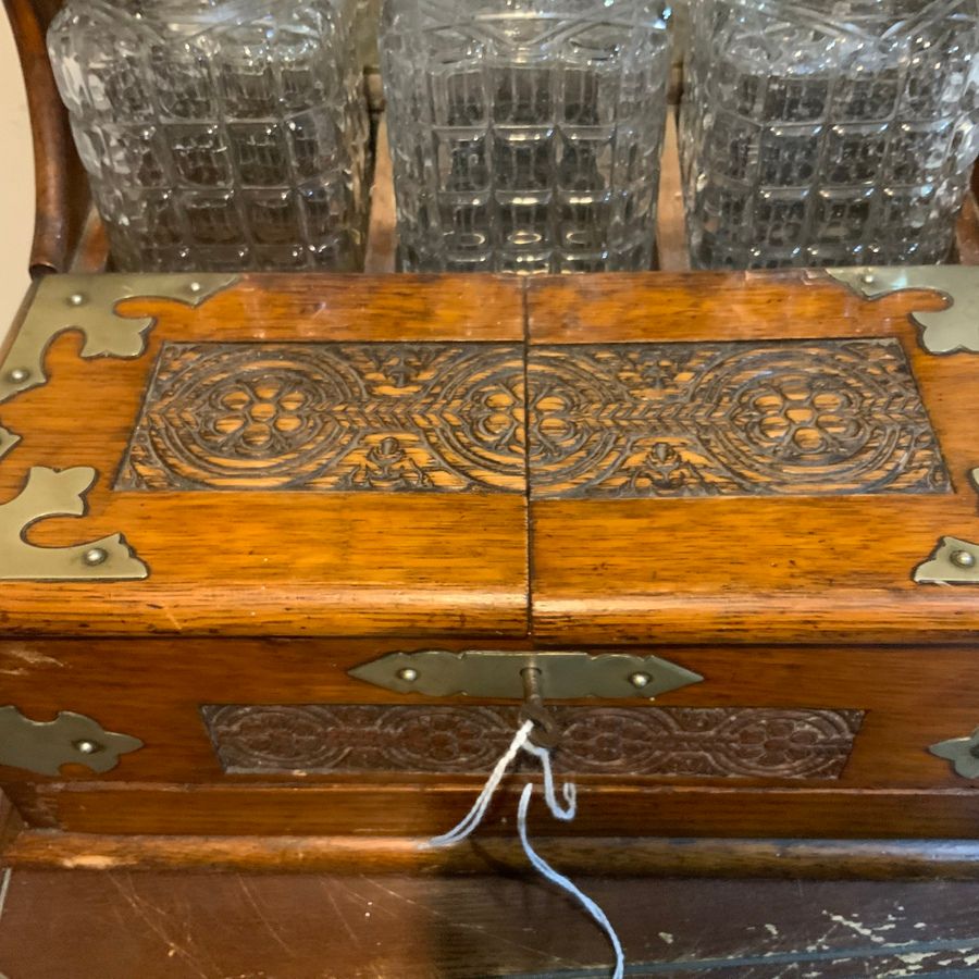 Antique Tantalus three decanter’s & Games in oak case