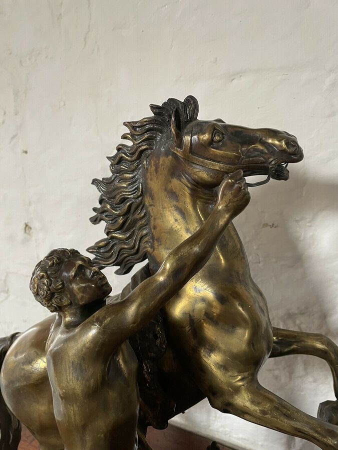 Antique A FINE PAIR OF GILT-BRONZE MODELS OF THE MARLEY HORSES.