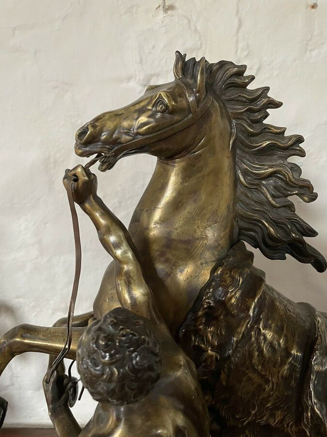 Antique A FINE PAIR OF GILT-BRONZE MODELS OF THE MARLEY HORSES.