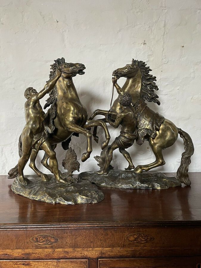 Antique A FINE PAIR OF GILT-BRONZE MODELS OF THE MARLEY HORSES.