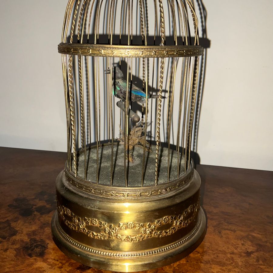 Antique AUTOMATON SINGING BIRD IN A GILDED CAGE.