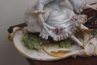 Antique porcelain girl & boy on seesaw European work 