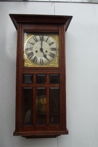 Antique Wall clock 8 day mechanical movement strikes on rods the hours