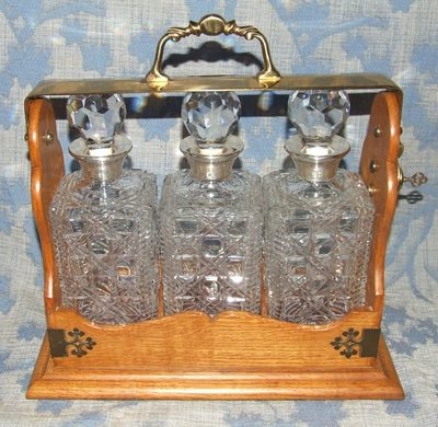 Antique Antique Style Oak TANTALUS with 3 Decanter / Bottle with Sterling Silver Necks