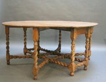 Antique Georgian oak drop leaf dining table