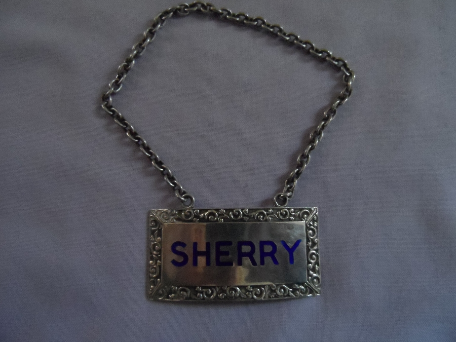 English Sterling silver and enamel decanter label