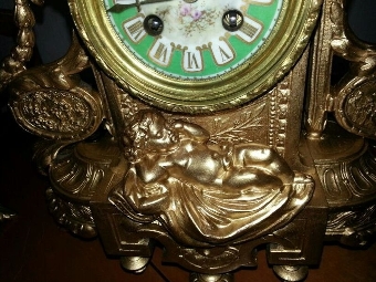 Antique Amazing antique bronze clock gold plated 1800-1850 with his candleholders