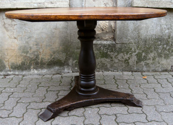 Antique A 19th century style round farmhouse table.