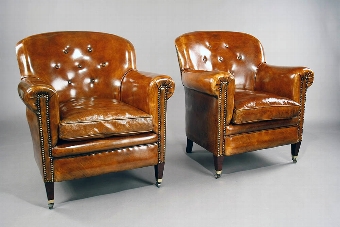 Antique A pair of Antique Leather Shaped Armchairs