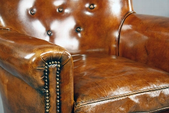 Antique A pair of Antique Leather Shaped Armchairs
