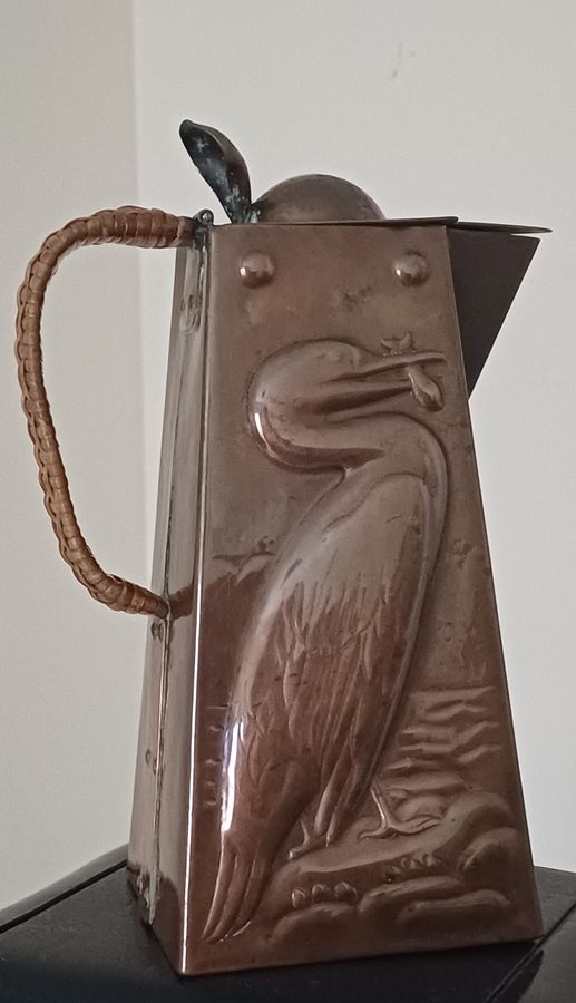 Antique A Newlyn copper Cormorant and John Dory decorated hot water jug, dating circa 1905