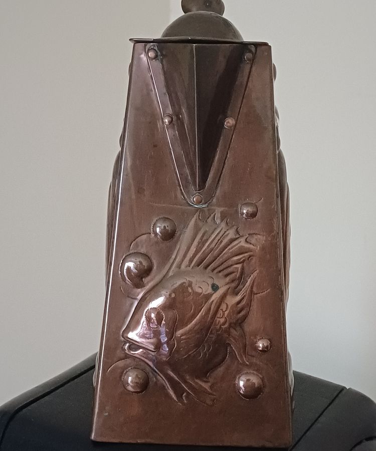 Antique A Newlyn copper Cormorant and John Dory decorated hot water jug, dating circa 1905