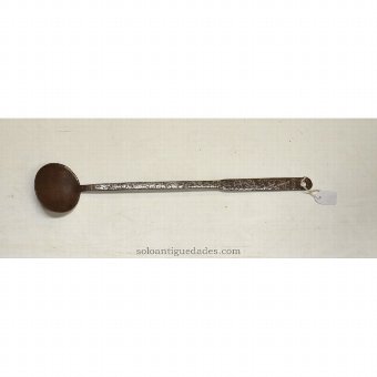 Antique Iron ladle with geometric designs on the handle