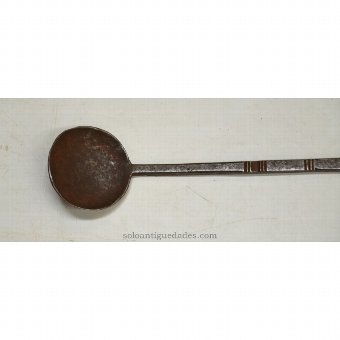 Antique Iron ladle with geometric engravings on the handle