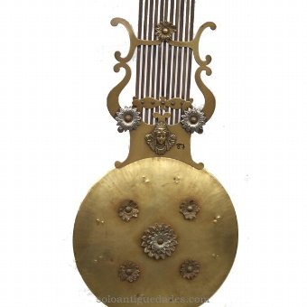 Antique Watch Type Morez. Lyre pendulum with floral decoration