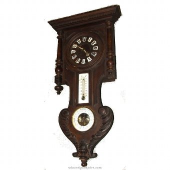 Wall clock. With thermometer and barometer