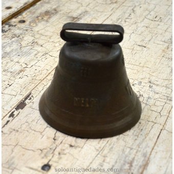 Antique Bell decorated with reliefs (cross and cow)