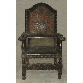 Wooden armchair with leather decoration