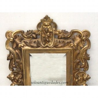 Antique Rococo style mirror with angel