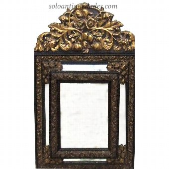 Mirror Baroque influence and ormolu frame