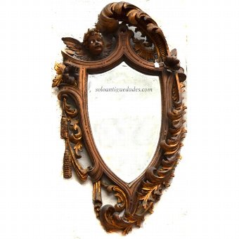 Wall mirror as a shield or escutcheon