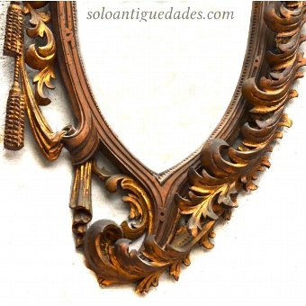 Antique Wall mirror as a shield or escutcheon
